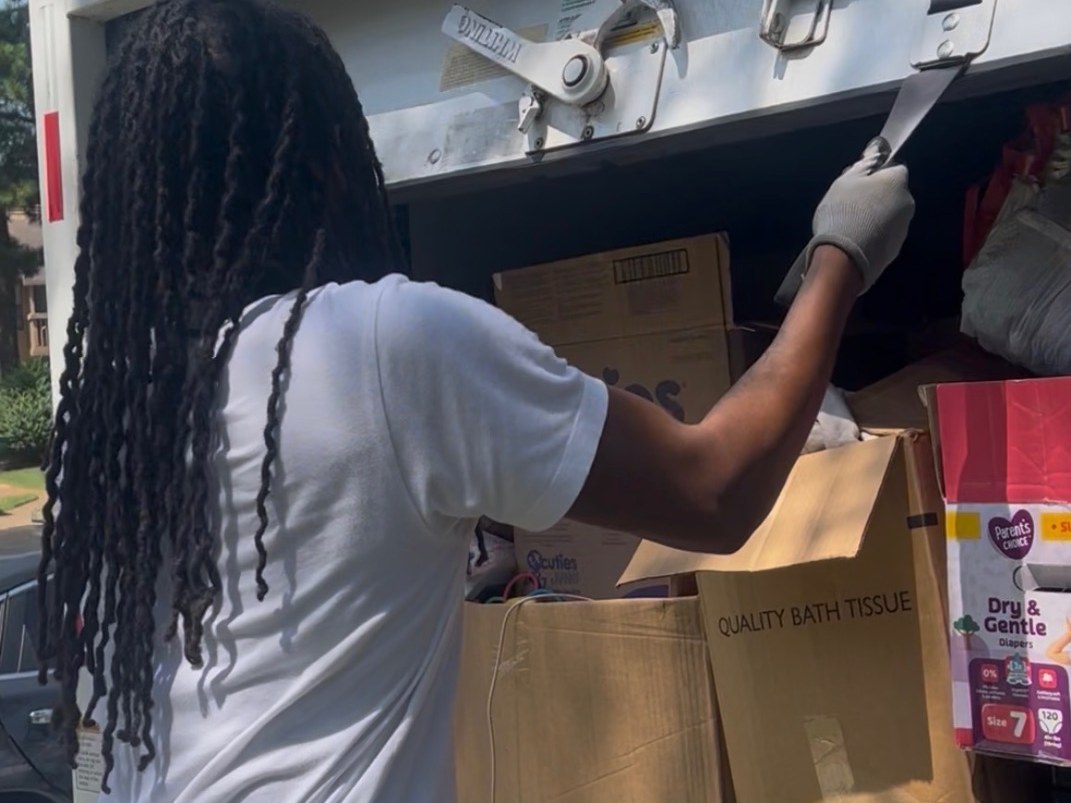 Movers loading boxes into the truck